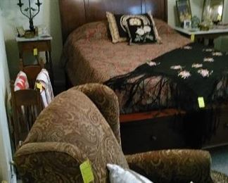 Sleigh bed, recliner, marble top side tables with unique table lamps, quilt rack and quilts