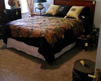 Asian style bed and side table with Asian tapestries, unique table lamp