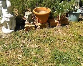 Garden terracotta and cement statuary, potted plants