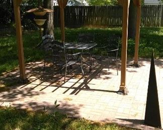 5 piece metal garden table with 4 chairs, hanging metal decoration and metal pyramid