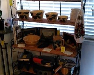 Baker's rack with original art, Watt bowls and various kitchen appliances.