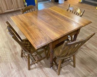 Drop leaf table with four chairs