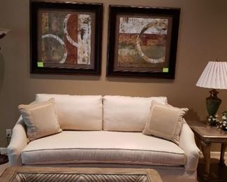 Cream Bassett sofa, art, floor lamp, side table, table lamp