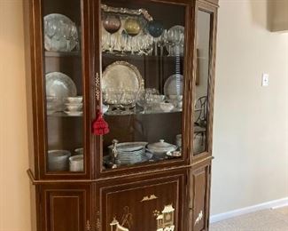 ornately vintage Chinese breakfront    the lower portion features cabinet space for private storage ornately chinese motifs adorn the cabinet doors 