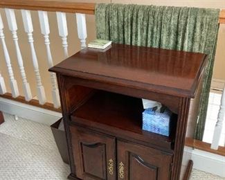 side table with magazine rack on side