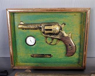 Cast Iron, Carved Wood And Plastic Replica Revolvers And Framed Colt .38 Wall Decor