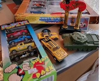 Match Box Hot Wheels and Other Toys and 75th Anniversary How Wheels Stand