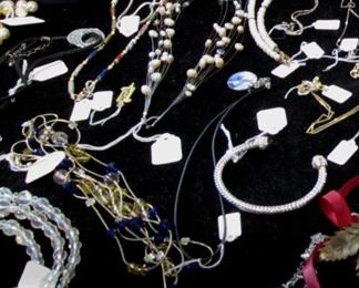 Don't let the poor images dissuade you from looking at the costume jewelry. There is some nice sterling silver and some nice Swarovski.