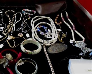 Don't let the poor images dissuade you from looking at the costume jewelry. There is some nice sterling silver and some nice Swarovski.