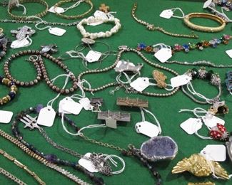 Don't let the poor images dissuade you from looking at the costume jewelry. There is some nice sterling silver and some nice Swarovski.