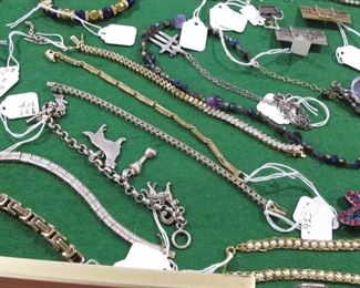 Don't let the poor images dissuade you from looking at the costume jewelry. There is some nice sterling silver and some nice Swarovski.