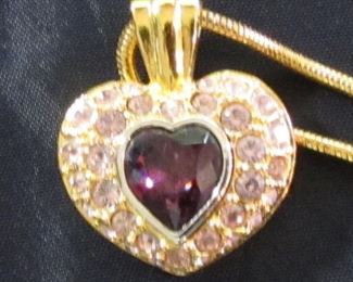One of several pieces of Swarovski Costume Jewelry being offered. Image out of focus.