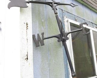 Weather vane about 8 feet tall