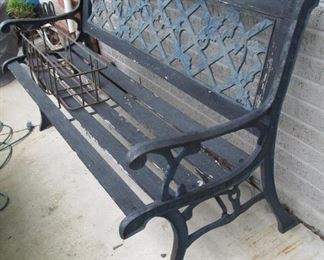 iron + wood bench on front porch
