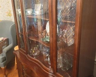 Serpentine front China cabinet