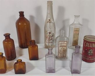 Brown, Purple & Labeled Advertising Glass Bottles	