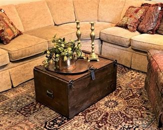 This antique wooden trunk makes a perfect coffee table.