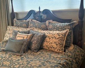 Bedding with decorative pillows and shams