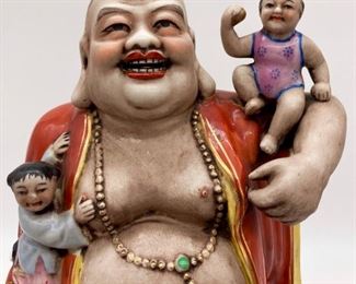 Vintage Laughing Buddha with children figurine