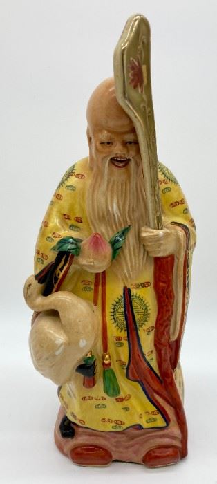 Vintage Asian figurine man with bird and staff