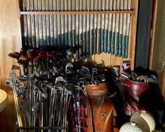 Hundreds of golf clubs and several golf bags