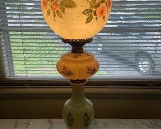Globe lamp with 3 completely different light up sections, on a gold base.