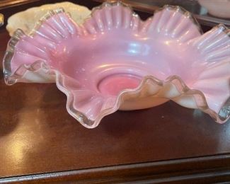 Pink glass bold with scalloped edges.