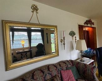 Gorgeous gold mirror with decorative edges and and unique hanging option. Made by the Carolina Mirror Company.