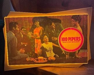 Working vintage 100 Pipers bar light. Corners broken off.