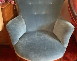 Green/blue rocker with a velour fabric.