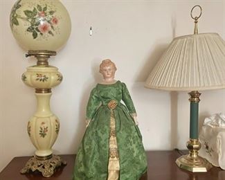 2 lamps and a porcelain decorative doll.