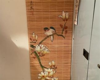 Asian bamboo panel with birds, flowers, and Asian writing.