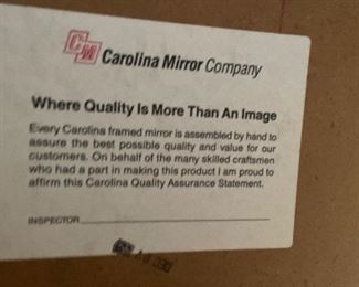 Gorgeous gold mirror with decorative edges and and unique hanging option. Made by the Carolina Mirror Company.