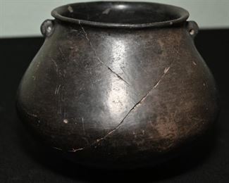 Pre-Columbian blackware Casa Grande pottery.  Many of these pieces have been broken and repaired. 