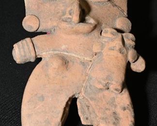 Pre-Columbian maternal figure with baby-Broken in multiple places and repaired.  Flat figure interestingly. 