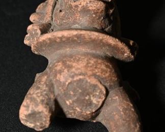 A portion of a Pre-Columbian zoomorphic figure.  I think it's supposed to be a dragon-perhaps a shaman. 