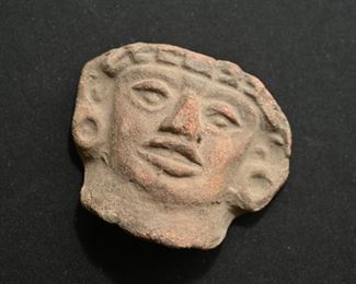 Pre-Columbian stone head deity.