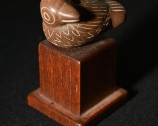 Miniature carved bird on wood base-probably Chimu.