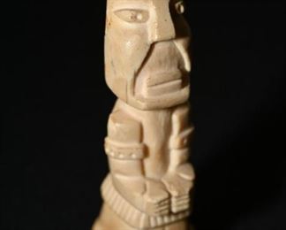 Pre-columbian Taino carved bone amulet figure.  Again looks much like the Easter Island totems. 