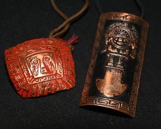 Etched copper pendants on leather 