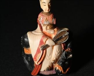 Carved bone empress riding a bull.  We have two of these. 
