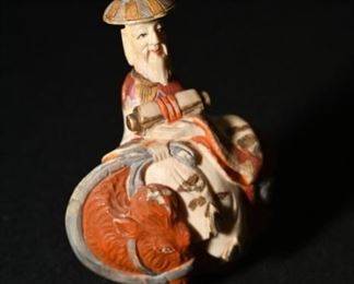 Carved bone emperor riding a cow.  We have two of these.