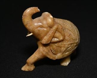 Carved stone elephant-missing one tusk and part of his trunk.  