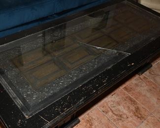 Glass topped ornate door coffee table
