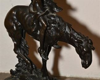 Bronze sculpture of man on horse. After Frasier