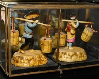 Carved miniature farmers