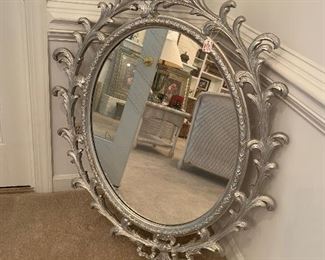 Wood, oval antique mirror painted silver.  This piece is around 65+ years old. Price $200.00