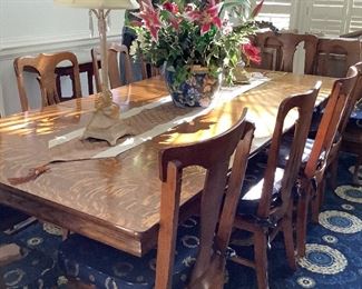Claw footed  dining room table with 6 leaves. There are 12 chairs total.  Price includes chairs or will consider offer without chairs.  $1350.00.