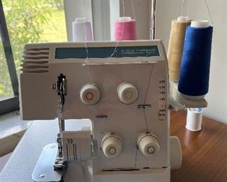 Baby lock, lot's of threads, material and sewing items