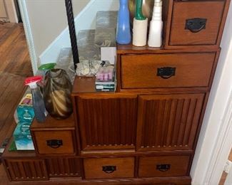 Custom wood cabinet in shape of stairs with draws